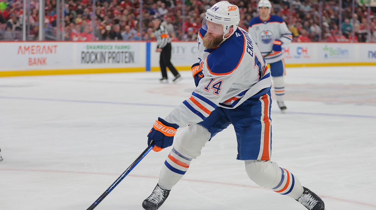 Edmonton Oilers defenseman Mattias Ekholm (14) shoots the puck against the Florida Panthers during the first period at Amerant Bank Arena.