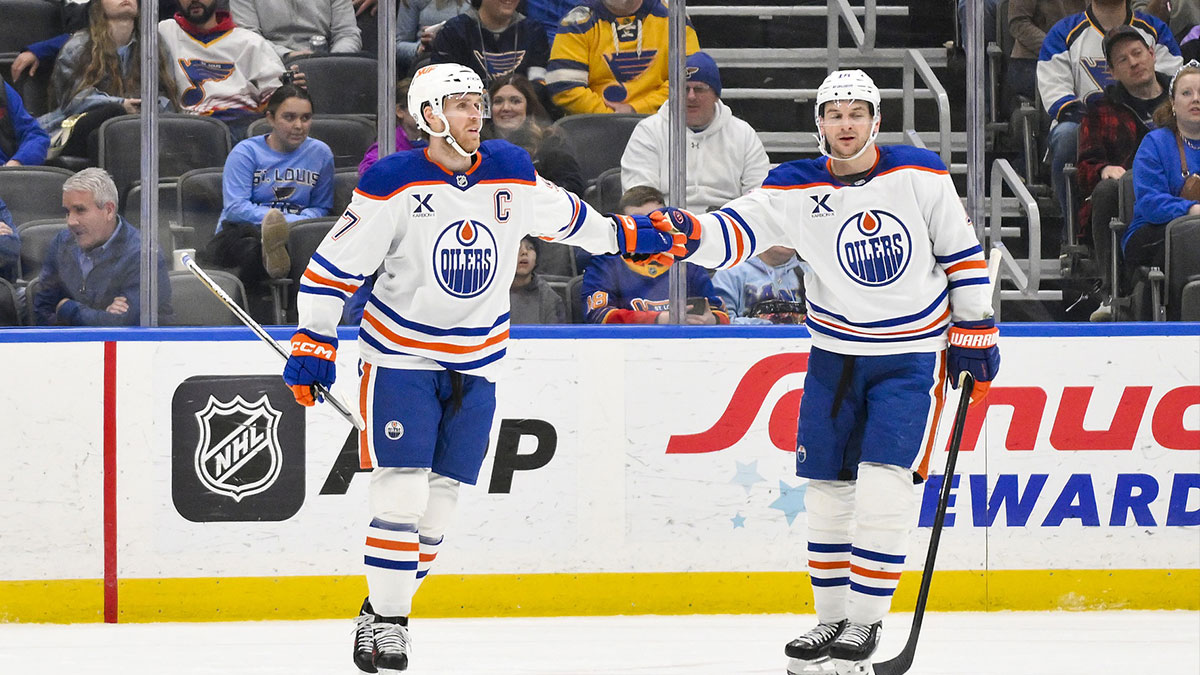 Edmonton Oilers center Connor McDavid (97) is congratulated by Edmonton Oilers left wing Zach Hyman (18) after scoring against the St. Louis Blues during the second period at Enterprise Center.