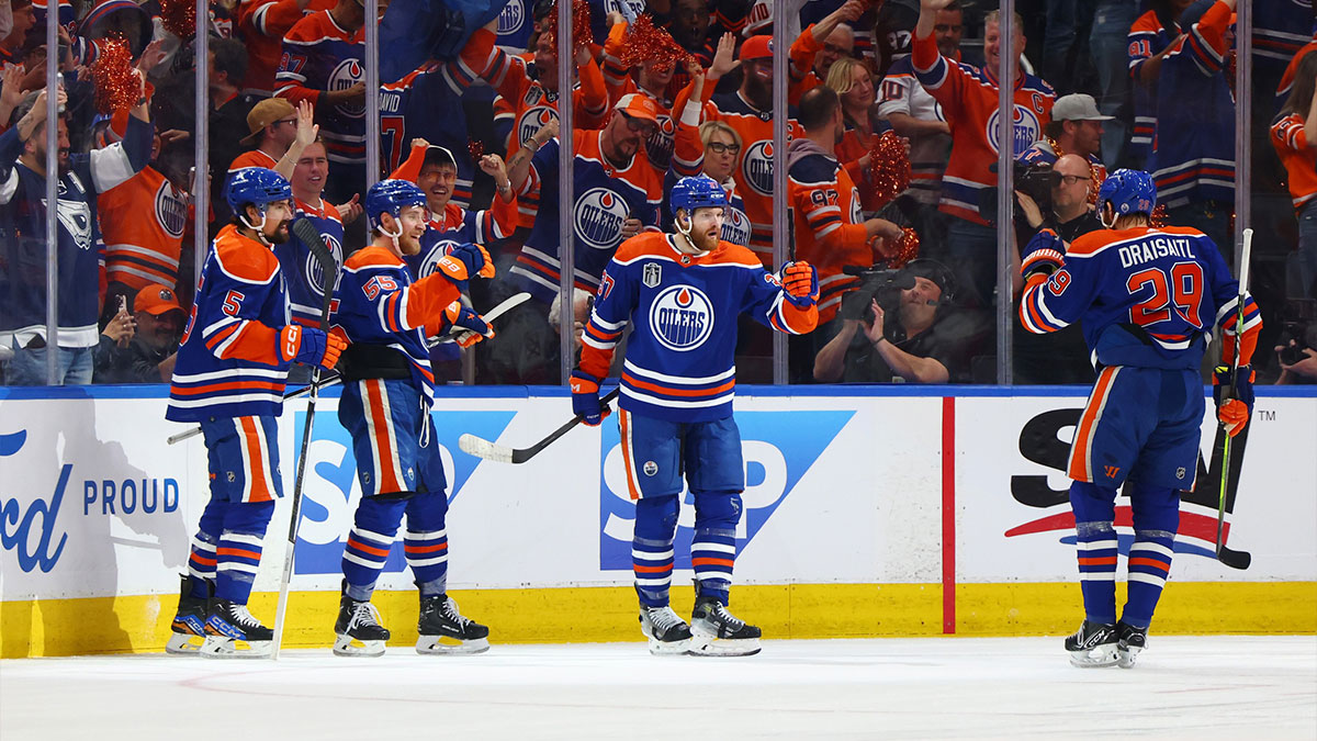 Edmonton Oilers left wing Warren Foegele (37) celebrates with teammates after scoring a goal in the first period against the Florida Panthers in game six of the 2024 Stanley Cup Final at Rogers Place.