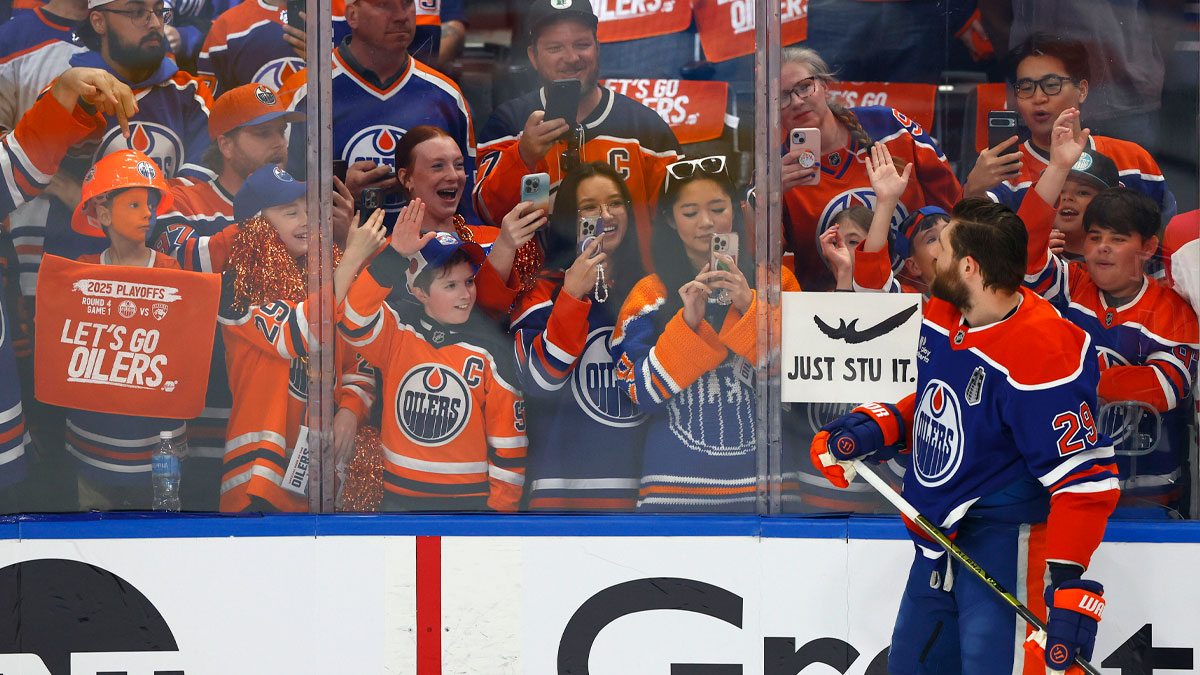 Oilers center Leon Draisaitl (29) reacts with fans