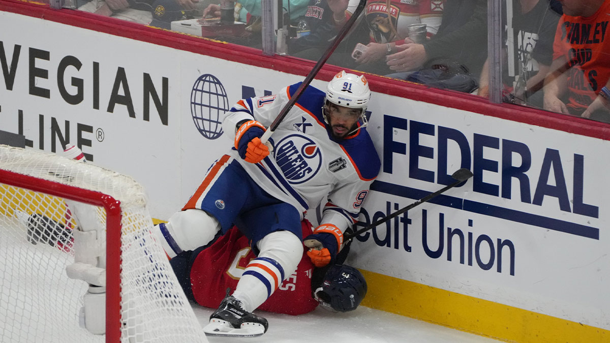 Edmonton Oilers left wing Evander Kane (91) boards Florida Panthers defenseman Seth Jones (3) during the first period in game four of the 2025 Stanley Cup Final at Amerant Bank Arena.