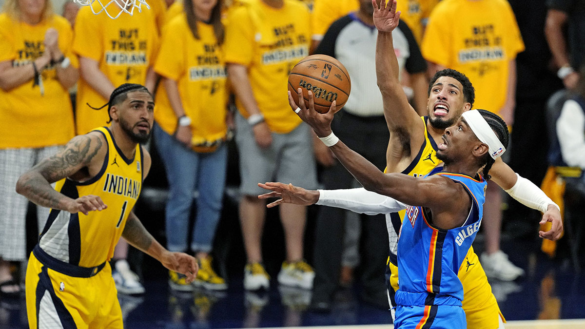Oklahoma City Thunder guard Shai Gilgeous-Alexander (2) shoots the ball against Indiana Pacers guard Tyrese Haliburton (0) during the second quarter in game three of the 2025 NBA Finals at Gainbridge Fieldhouse.