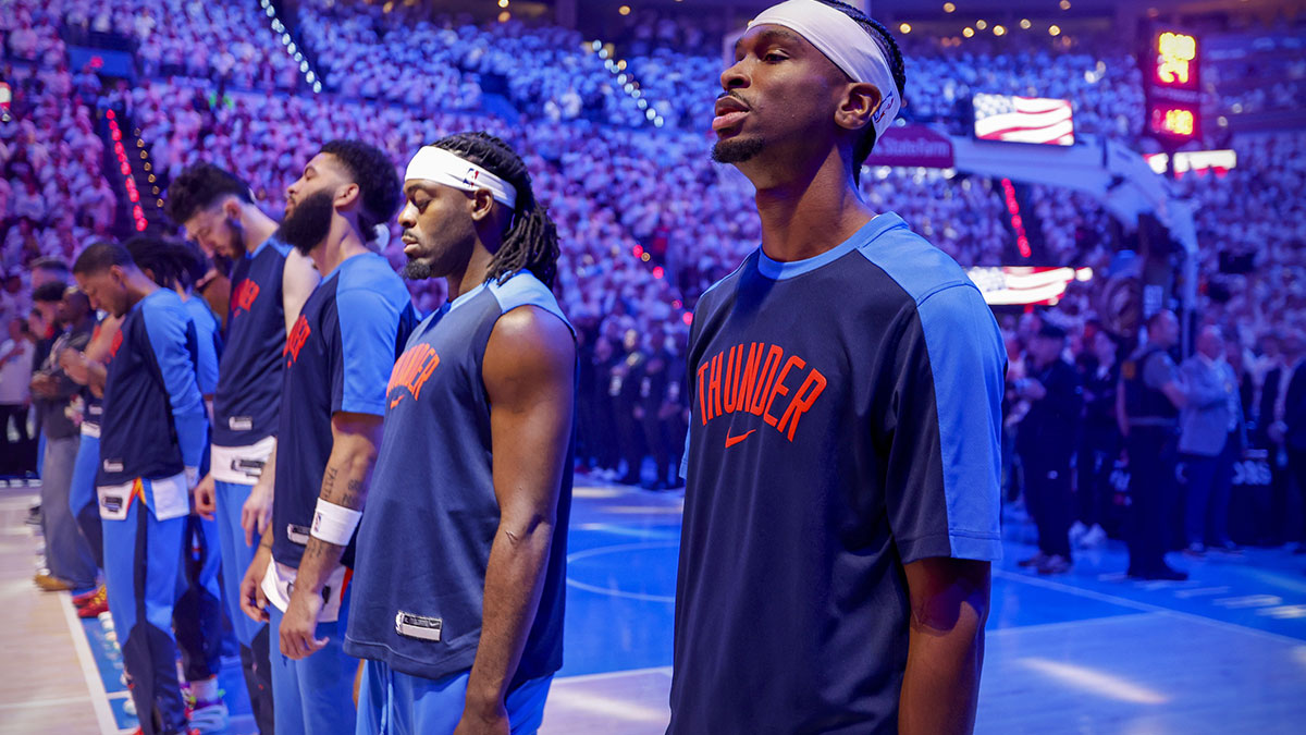 Oklahoma City Thunder guard Shai Gilgeous-Alexander (2) stands during the national anthem before the first quarter against the Indiana Pacers during game one of the 2025 NBA Finals at Paycom Center.