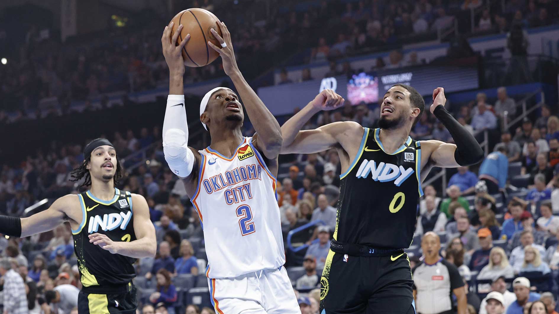Oklahoma City Thunder guard Shai Gilgeous-Alexander (2) drives to the basket beside Indiana Pacers guard Tyrese Haliburton (0) during the first quarter at Paycom Center. Magic Johnson