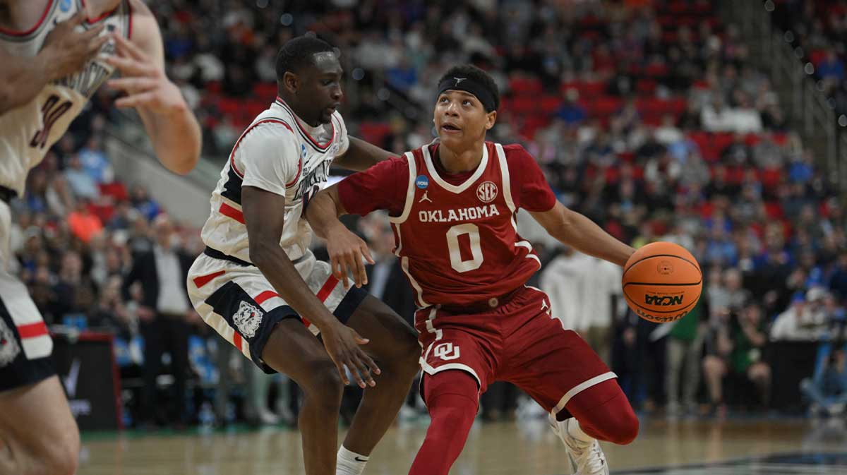 Oklahoma Sooners guard Jeremiah Fears (0) controls the ball against Connecticut Huskies during the second half at Lenovo Center. Thomas Sorber and Joan Beringer