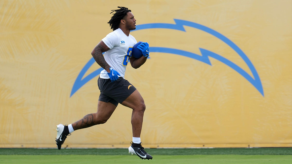 Los Angeles Chargers running back Omarion Hampton (8) carries the ball during offseason workouts at The Bolt.