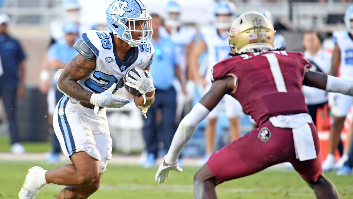 North Carolina Tarheels running back Omarian Hampton (28) runs the ball against the Florida State Seminoles during the third quarter at Doak S. Campbell Stadium.