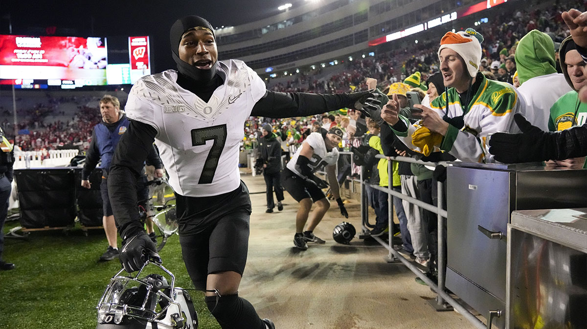 Oregon Ducks wide receiver Evan Stewart (7) greets fans following the game against the Wisconsin Badgers at Camp Randall Stadium.
