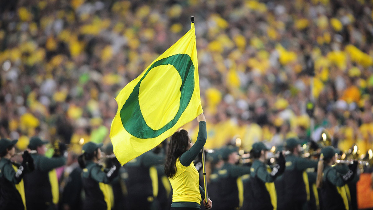 A member of the Oregon Ducks dance team holds a flag against the Auburn Tigers during the 2011 BCS National Championship game at University of Phoenix Stadium. The Tigers defeated the Ducks 22-19.