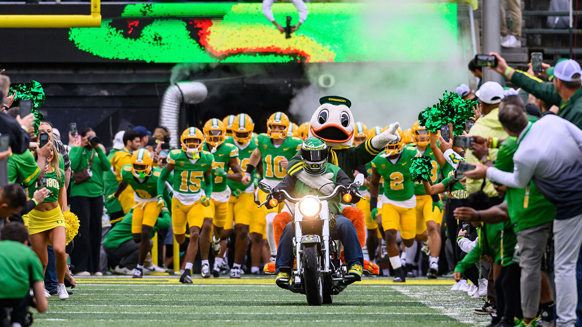 Oregon Ducks mascot The Duck leads the team entrance against the Washington State Cougars at Autzen Stadium.