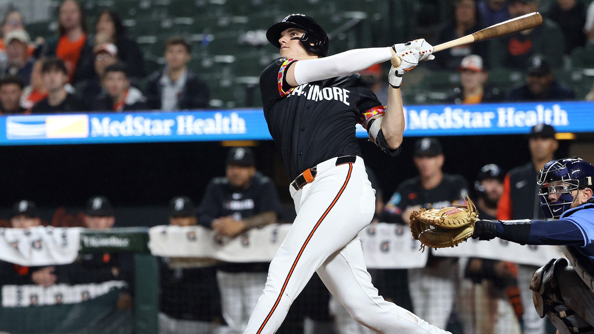 Baltimore Orioles third baseman Coby Mayo (16) hits a home run during the eighth inning against the Tampa Bay Rays at Oriole Park at Camden Yards.