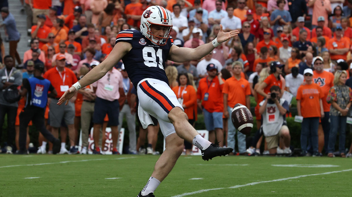Auburn Tigers punter Oscar Chapman (91) kicks against the Oklahoma Sooners at Jordan-Hare Stadium.