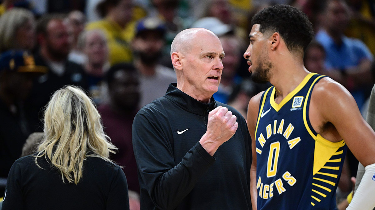 Indiana Pacers Head Coach Rick Carlisle shares a moment with Indiana Pacers guard Tyrese Haliburton (0) during overtime at Gainbridge Fieldhouse.