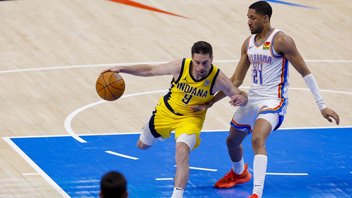 Indiana Pacers guard T.J. McConnell (9) drives to the basket past Oklahoma City Thunder guard Aaron Wiggins (21) during the third quarter in game five of the 2025 NBA Finals at Paycom Center.