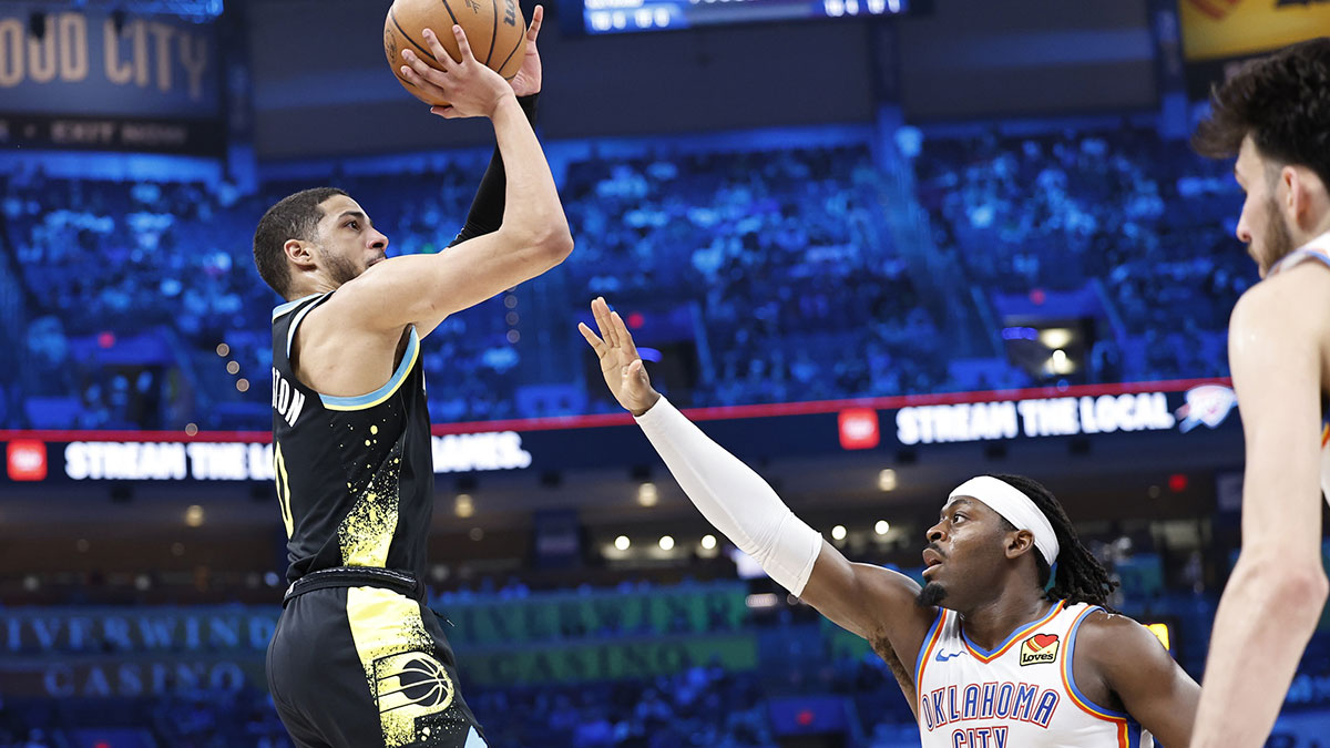 Pacers' Tyrese Haliburton shoots over Thunder's Lu Dort