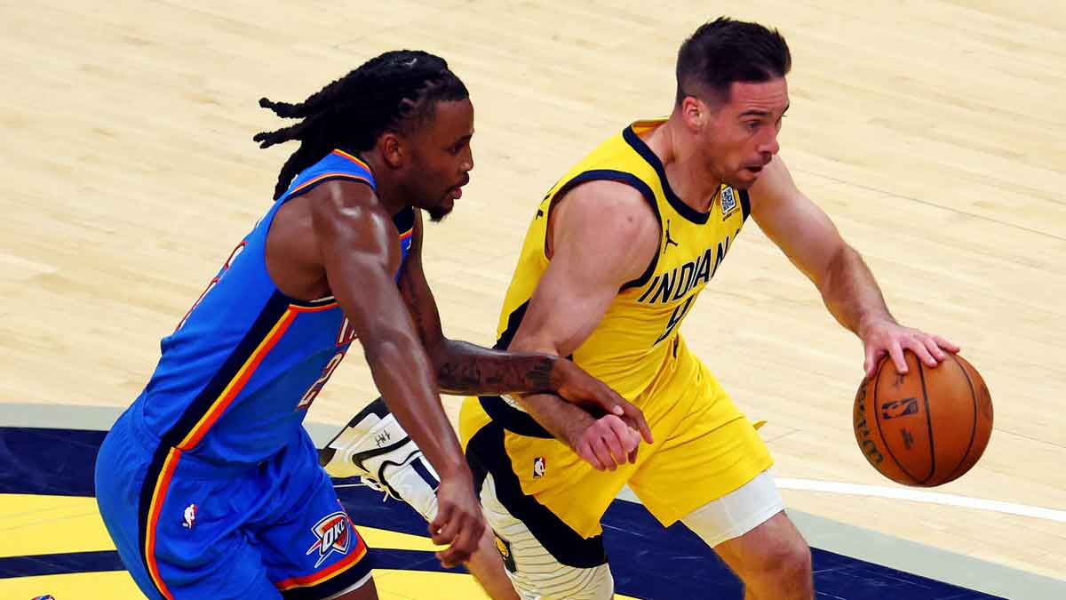Indiana Pacers guard T.J. McConnell (9) drives to the basket against Oklahoma City Thunder guard Cason Wallace (22) during the second quarter in game three of the 2025 NBA Finals at Gainbridge Fieldhouse.