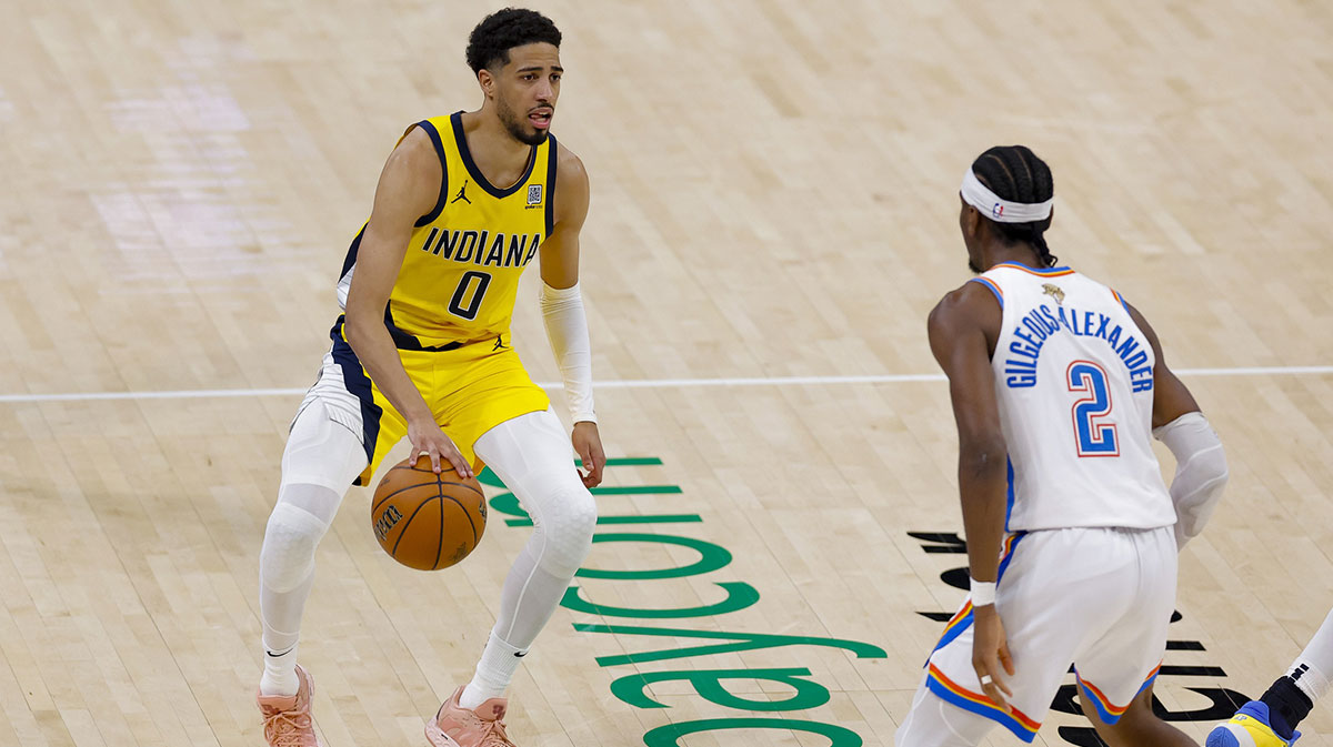 Pacers guard Tyrese Haliburton (0) brings the ball up