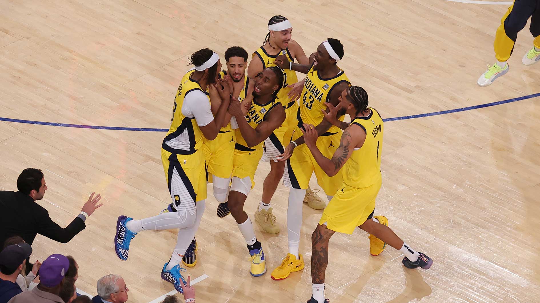 Indiana Pacers guard Tyrese Haliburton (0) celebrates with teammates after tying the game in the fourth quarter to send the game to overtime against the New York Knicks during game one of the eastern conference finals for the 2025 NBA Playoffs at Madison Square Garden.