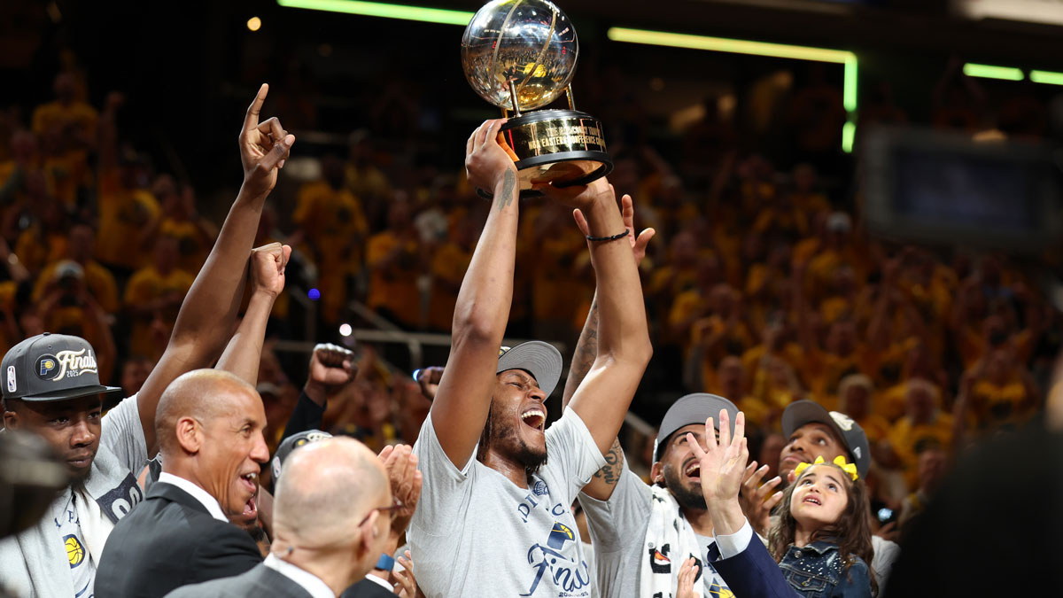 Indiana Pacers center Myles Turner (33) raises the trophy after game six of the eastern conference finals against the New York Knicks for the 2025 NBA Playoffs at Gainbridge Fieldhouse.