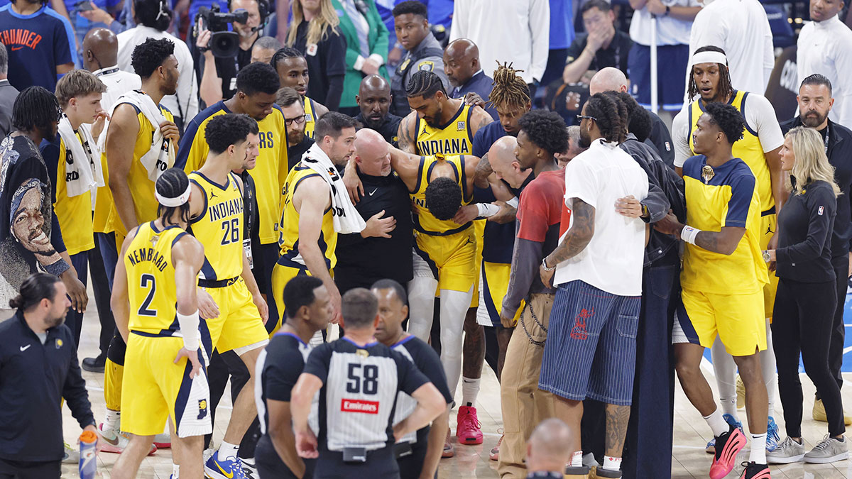 Indiana Pacers guard Tyrese Haliburton (0) is assisted after an apparent injury following a play against the Oklahoma City Thunder during the first half of game seven of the 2025 NBA Finals at Paycom Center.