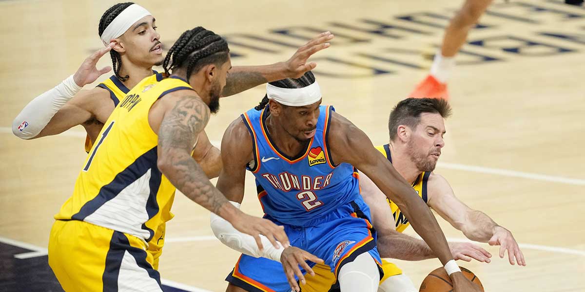 Oklahoma City Thunder guard Shai Gilgeous-Alexander (2) loses control of the ball against Indiana Pacers forward Obi Toppin (1) and guard T.J. McConnell (9) during the first half of game six of the 2025 NBA Finals between the Oklahoma City Thunder and the Indiana Pacers at Gainbridge Fieldhouse. Mandatory Credit: Kyle Terada-Imagn Images