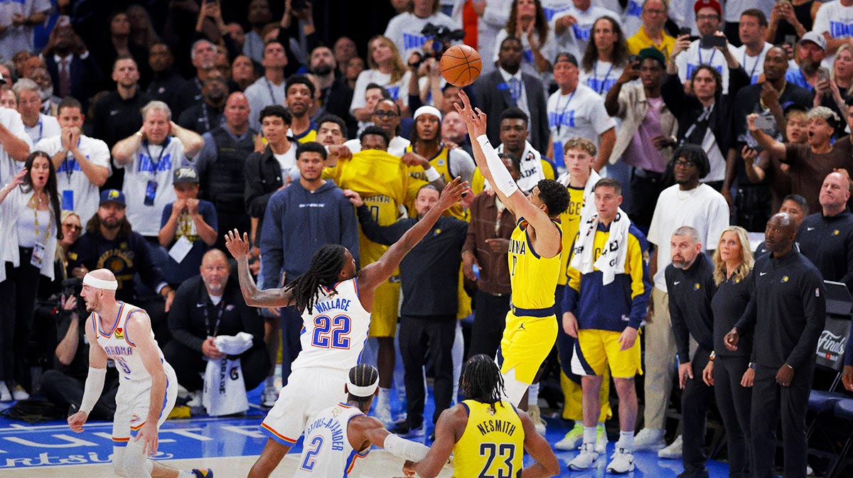 Indiana Pacers guard Tyrese Haliburton (0) makes the game winning shot over Oklahoma City Thunder guard Cason Wallace (22) during the fourth quarter during game one of the 2025 NBA Finals at Paycom Center.