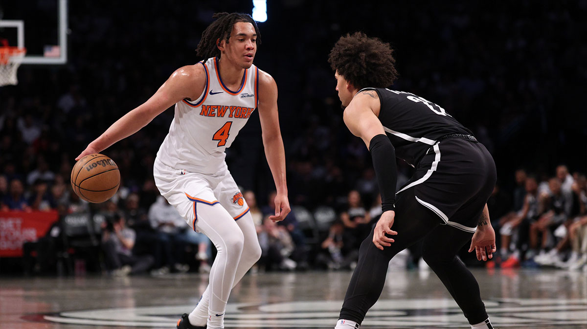 New York Knicks guard Pacome Dadiet (4) dribbles after the game Brooklyn Nets forward Jalen Wilson (22) during the first half at Barclays Center.