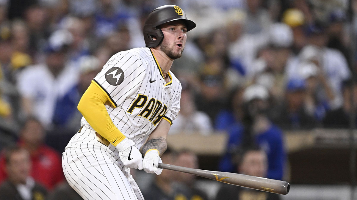 San Diego Padres center fielder Jackson Merrill (3) hits a RBI triple during the third inning against the Los Angeles Dodgers at Petco Park.
