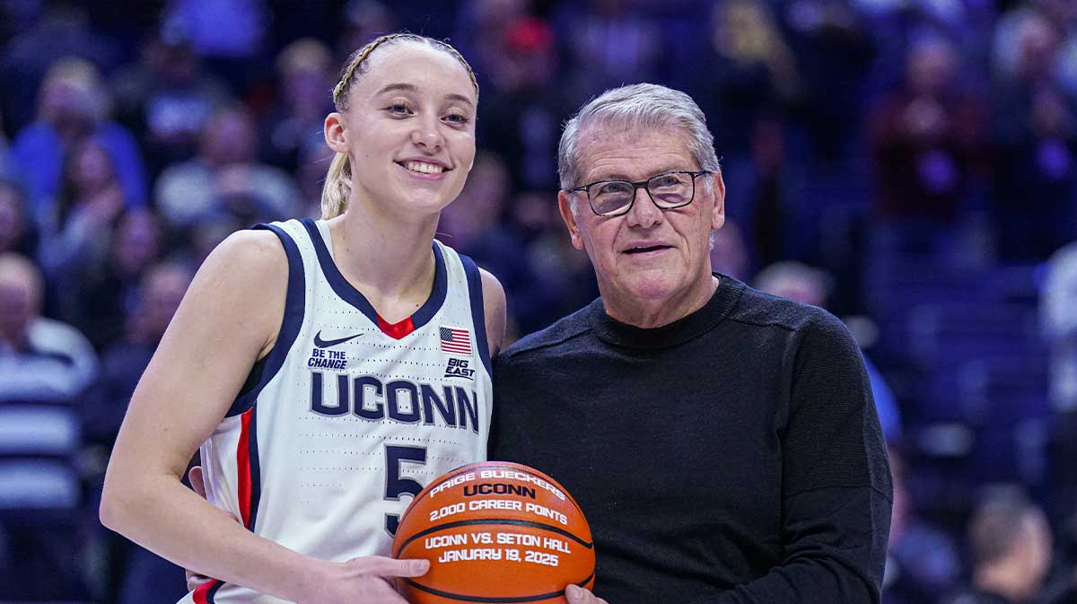 UConn Huskies guard Paige Bueckers (5) is recognized with head coach Geno Auriemma for her 2000 career points before the start of the game against the Villanova Wildcats at Harry A. Gampel Pavilion.