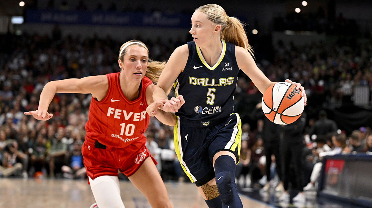 Dallas Wings guard Paige Bueckers (5) moves the ball past Indiana Fever guard Lexie Hull (10) during the game at the American Airlines Center.