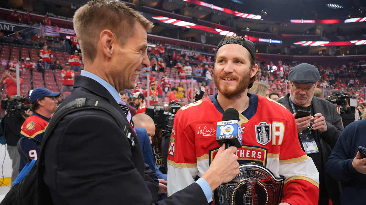 Florida Panthers left wing Matthew Tkachuk (19) is interviewed while wearing an belt after winning game six of the 2025 Stanley Cup Final against the Edmonton Oilers at Amerant Bank Arena.