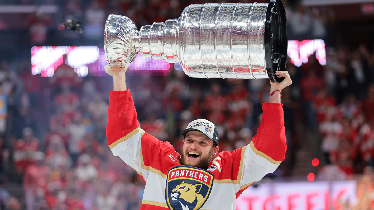 Florida Panthers center Aleksander Barkov (16) hoists the Stanley Cup after winning game six of the 2025 Stanley Cup Final against the Edmonton Oilers at Amerant Bank Arena.