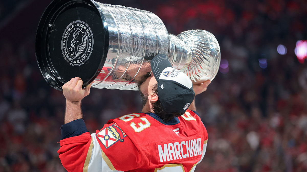 Florida Panthers center Brad Marchand (63) hoists the Stanley Cup after winning game six of the 2025 Stanley Cup Final against the Edmonton Oilers at Amerant Bank Arena.