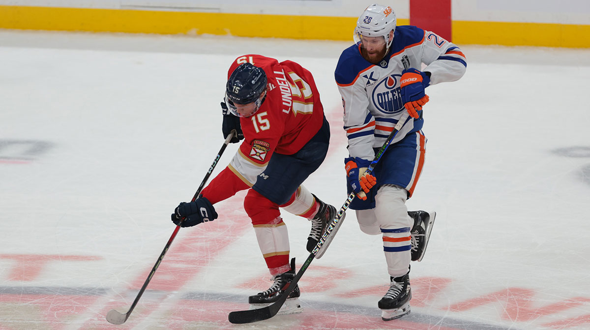 Florida Panthers forward Anton Lundell (15) controls the puck against Edmonton Oilers right wing Connor Brown (28) during the third period in game four of the 2025 Stanley Cup Final at Amerant Bank Arena.
