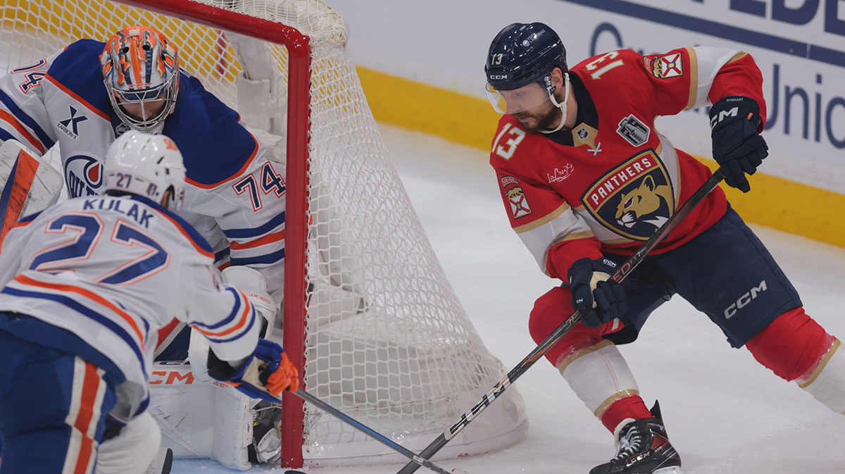 Florida Panthers forward Sam Reinhart (13) attempts a wrap around against Edmonton Oilers goaltender Stuart Skinner (74) and defenseman Brett Kulak (27) during the second period in game three of the 2025 Stanley Cup Final at Amerant Bank Arena.