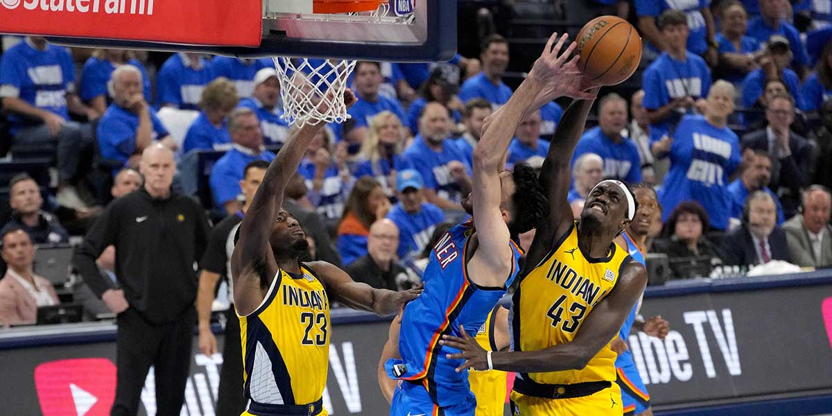 Indiana Pacers forward Aaron Nesmith (23) and forward Pascal Siakam (43) and Oklahoma City Thunder forward Chet Holmgren (7) battle for the rebound during the second quarter of game two of the 2025 NBA Finals at Paycom Center.