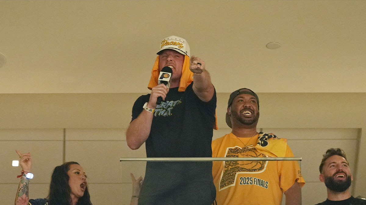 Pat McAfee talks to the crowd during the second half during game four of the 2025 NBA Finals between the Oklahoma City Thunder and the Indiana Pacers at Gainbridge Fieldhouse.