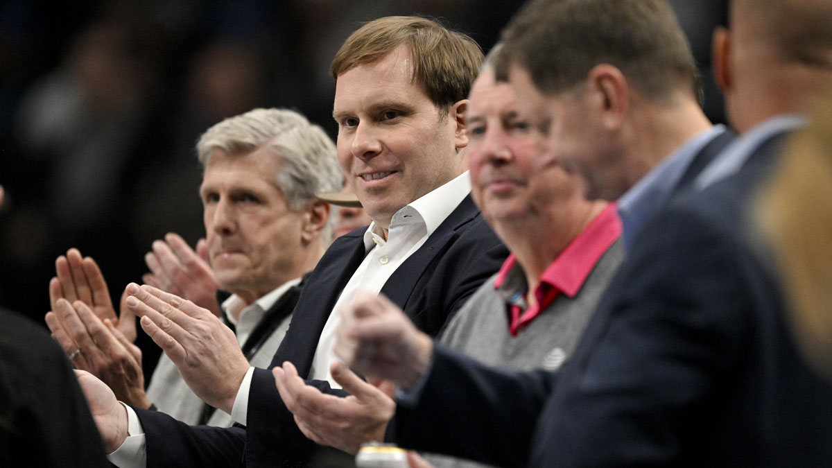 Dallas Mavericks governor (second from left) Patrick Dumont watches game between the Dallas Mavericks and the Sacramento Kings at the American Airlines Center.