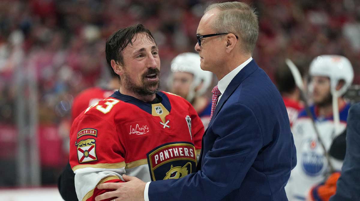 Florida Panthers center Brad Marchand (63) speaks to head coach Paul Maurice after winning game six of the 2025 Stanley Cup Final against the Edmonton Oilers at Amerant Bank Arena.