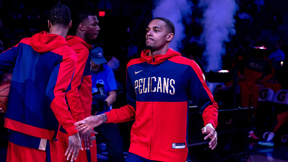 Pelicans guard Dejounte Murray warms up before a game against the Dallas Mavericks at Smoothie King Center