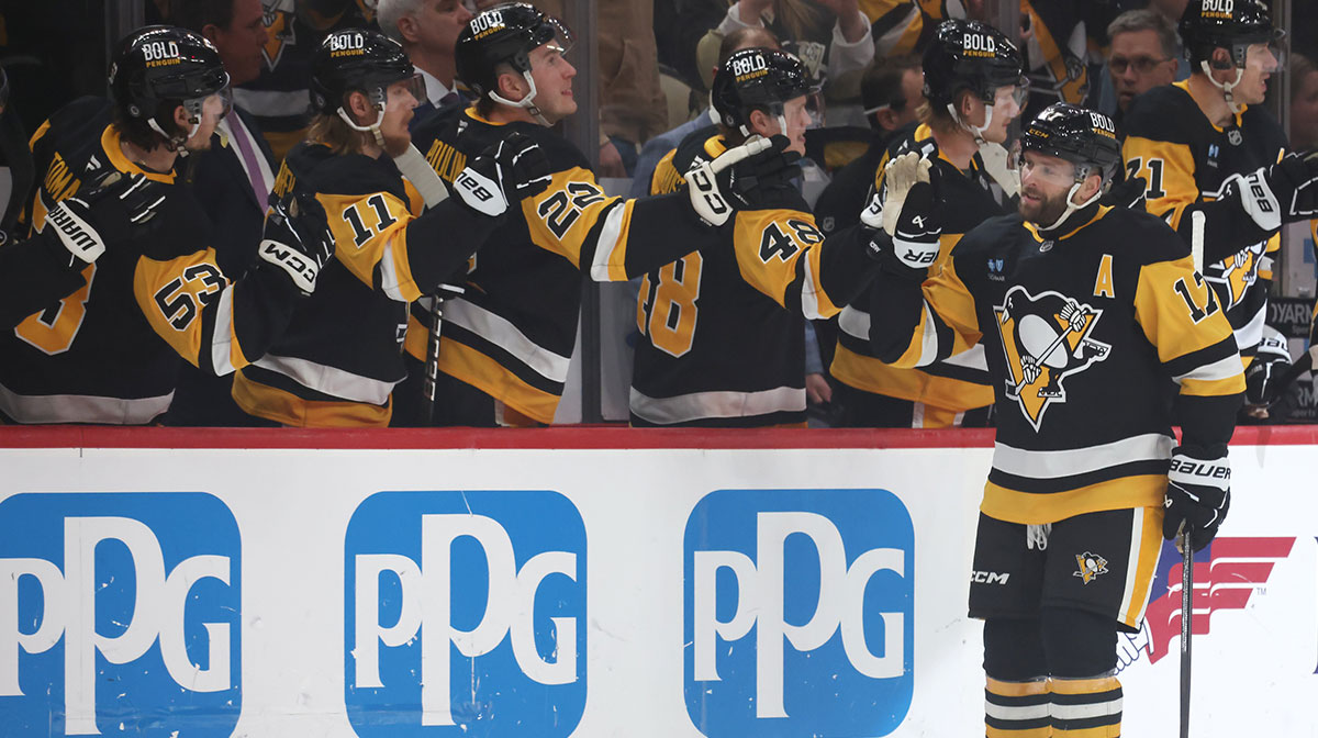 Pittsburgh Penguins right wing Bryan Rust (17) celebrates his goal with the Penguins bench against the Washington Capitals during the first period at PPG Paints Arena.