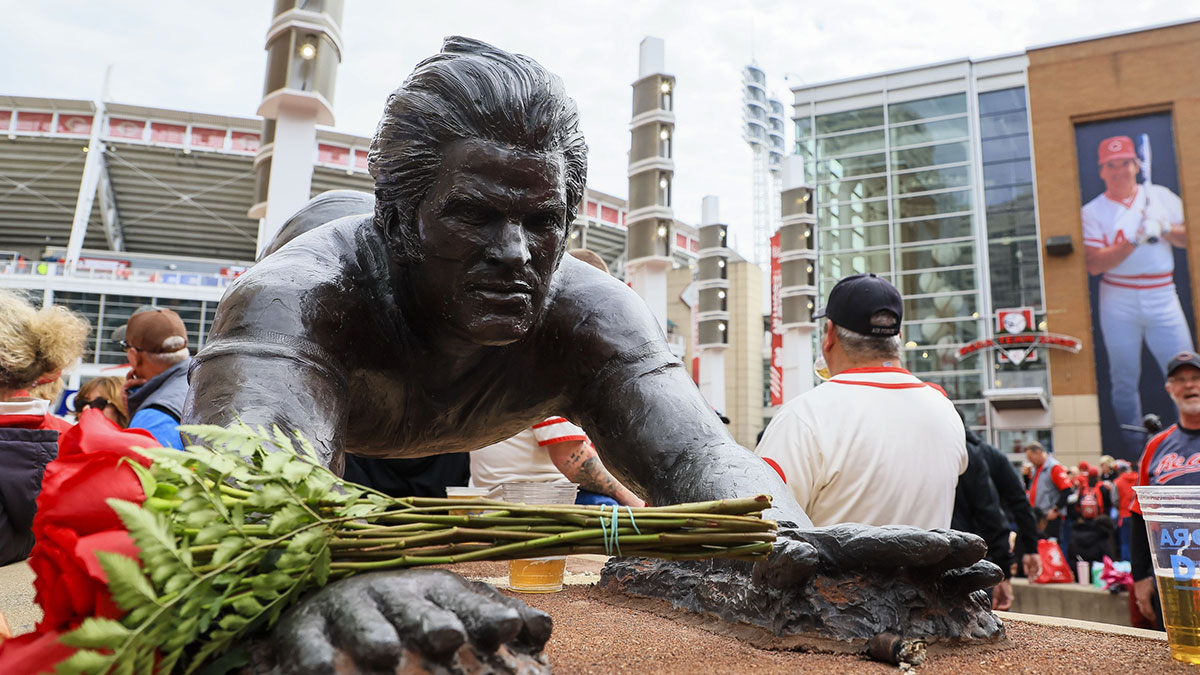 Roses are seen placed at a Pete Rose statue on Opening Day between the San Francisco Giants and the Cincinnati Reds.
