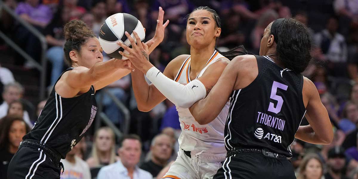 Phoenix Mercury forward Satou Sabally (0) drives on Golden State Valkyries forward Kayla Thornton (5) in the second half at Footprint Center.