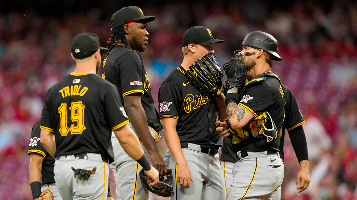 Pittsburgh Pirates pitcher Mitch Keller (23) is visited at the mound in the first inning of the MLB National League game between the Cincinnati Reds and the Pittsburgh Pirates at Great American Ball Park on Tuesday, June 25, 2024. The Pirates won the second game of the series, 9-5.