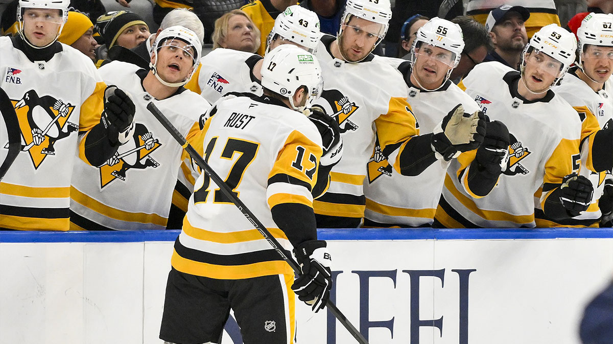 Pittsburgh Penguins right wing Bryan Rust (17) is congratulated by teammates after scoring against the St. Louis Blues during the first period at Enterprise Center.
