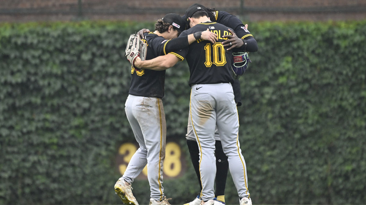 Pittsburgh Pirates outfielder Adam Frazier (26), outfielder Oneil Cruz (15) and outfielder Bryan Reynolds (10) after the game against the Chicago Cubs at Wrigley Field.
