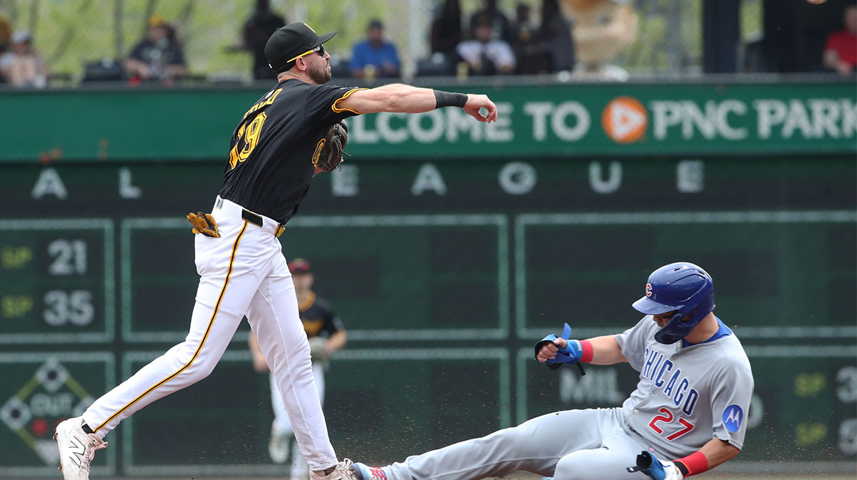 Pittsburgh Pirates second baseman Jared Triolo (19) throws to first base to complete a double play over Chicago Cubs designated hitter Seiya Suzuki (27) during the third inning at PNC Park.
