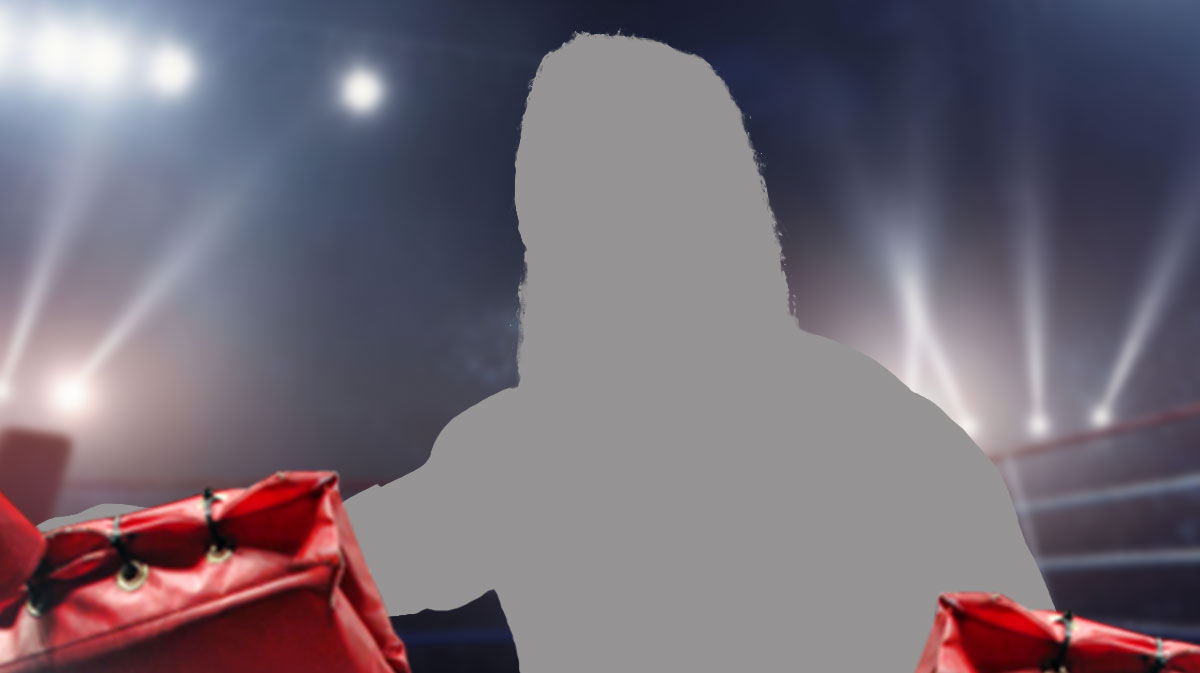 Silhouette of WWE Superstar Karrion Kross in a wrestling ring.