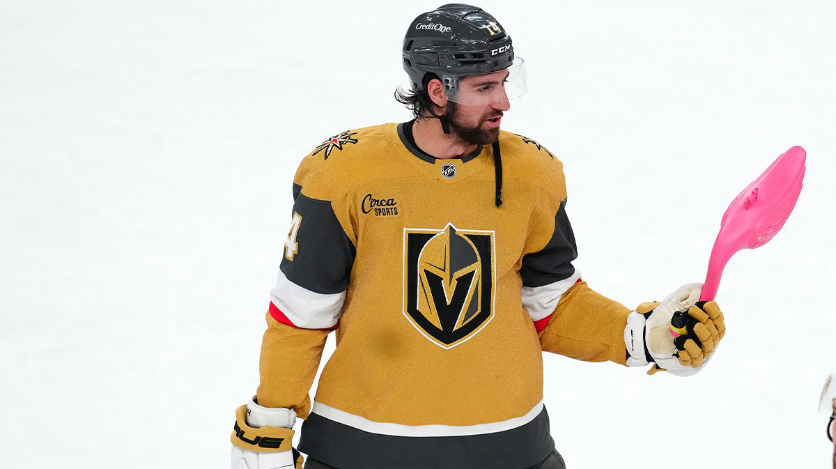 Vegas Golden Knights defenseman Nicolas Hague (14) holds a pink flamingo after the Golden Knights defeated the Chicago Blackhawks 7-5 at T-Mobile Arena.