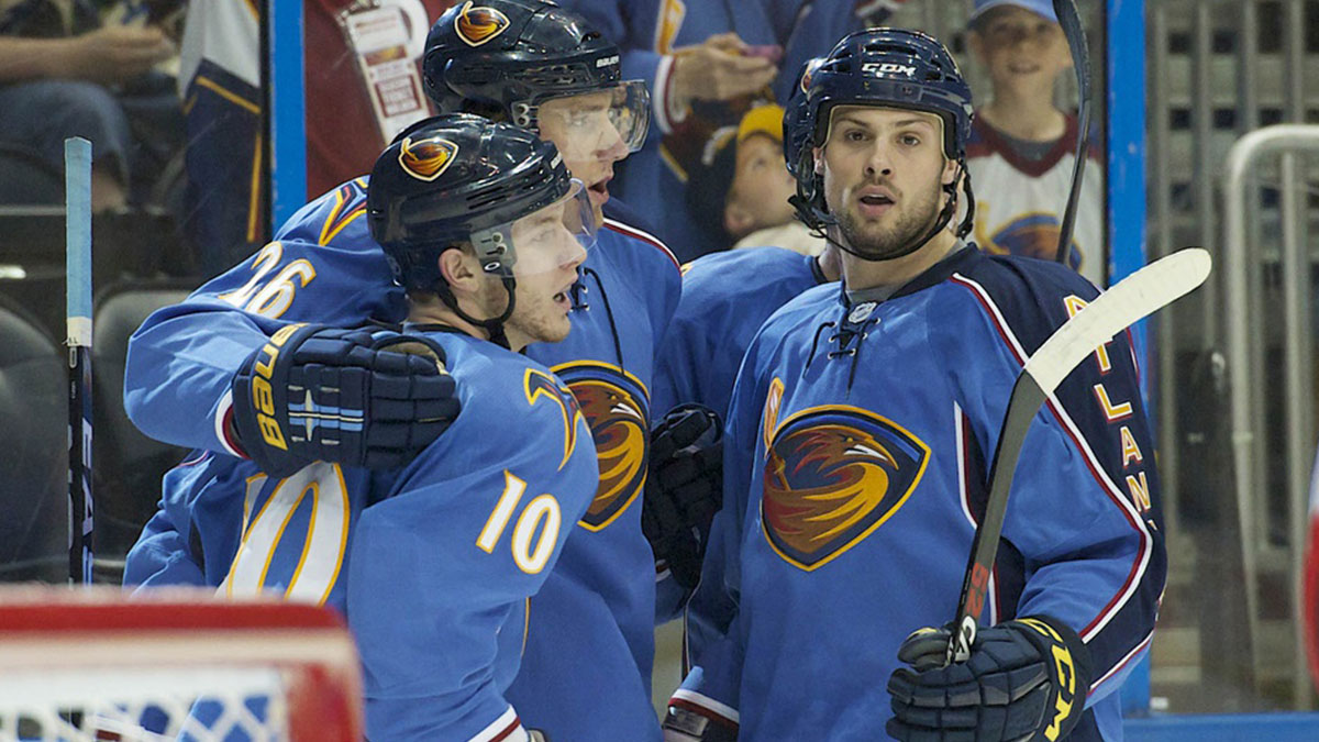 Atlanta Thrashers center Bryan Little (10) celebrates scoring a goal against the Ottawa Senators with right wing Blake Wheeler (26) and defenseman Zach Bogosian (4) in the second period at Philips Arena.